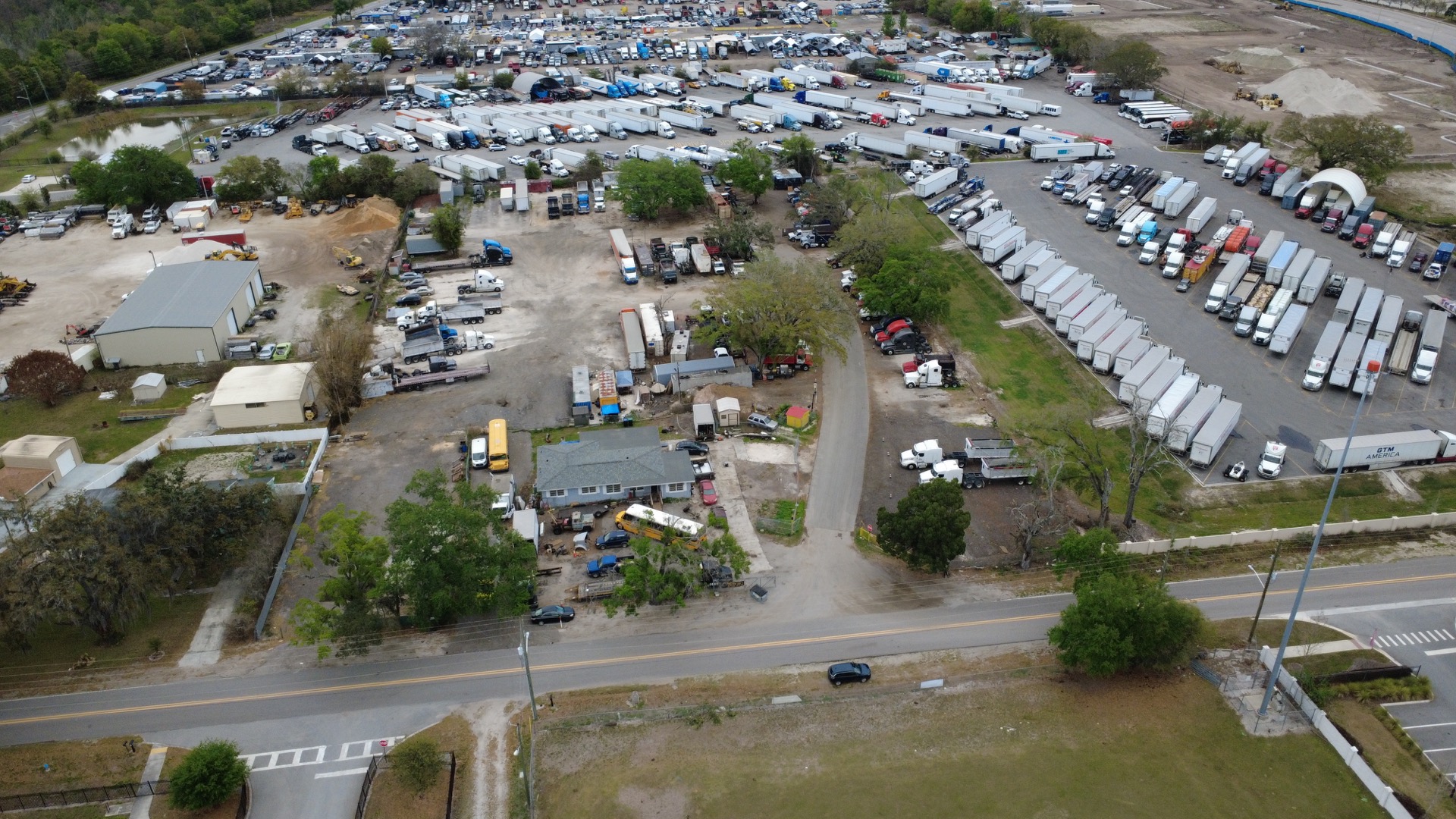 Alex and Family Trucking truck hauling materials in Central Florida